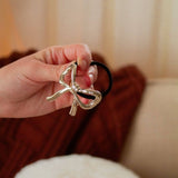 Gilded Bow Ponytail Cuff