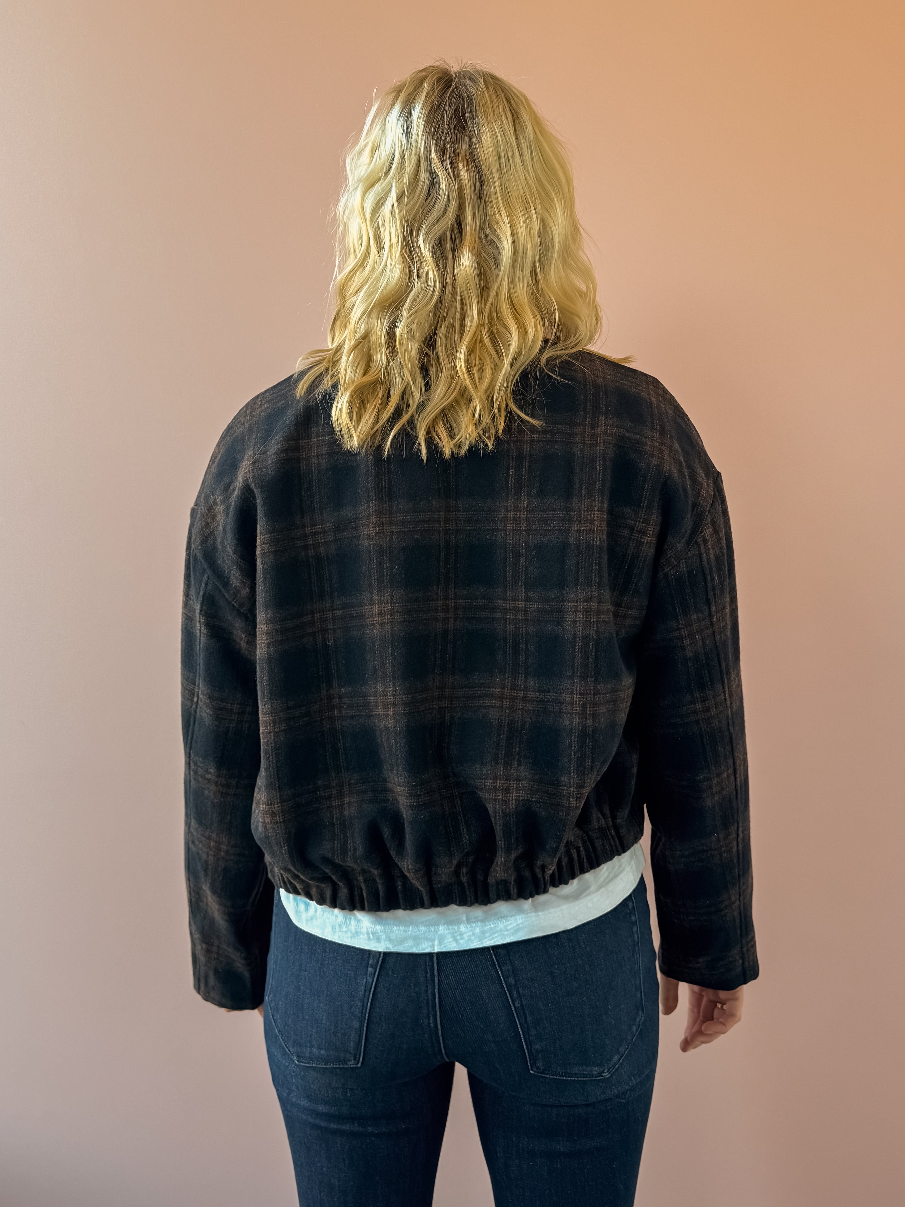Zoe & Claire Darcy Plaid Jacket in black and brown plaid, back view.