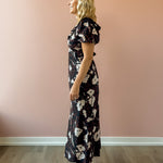 Heartloom Vivan Midi Dress in black floral, side view.