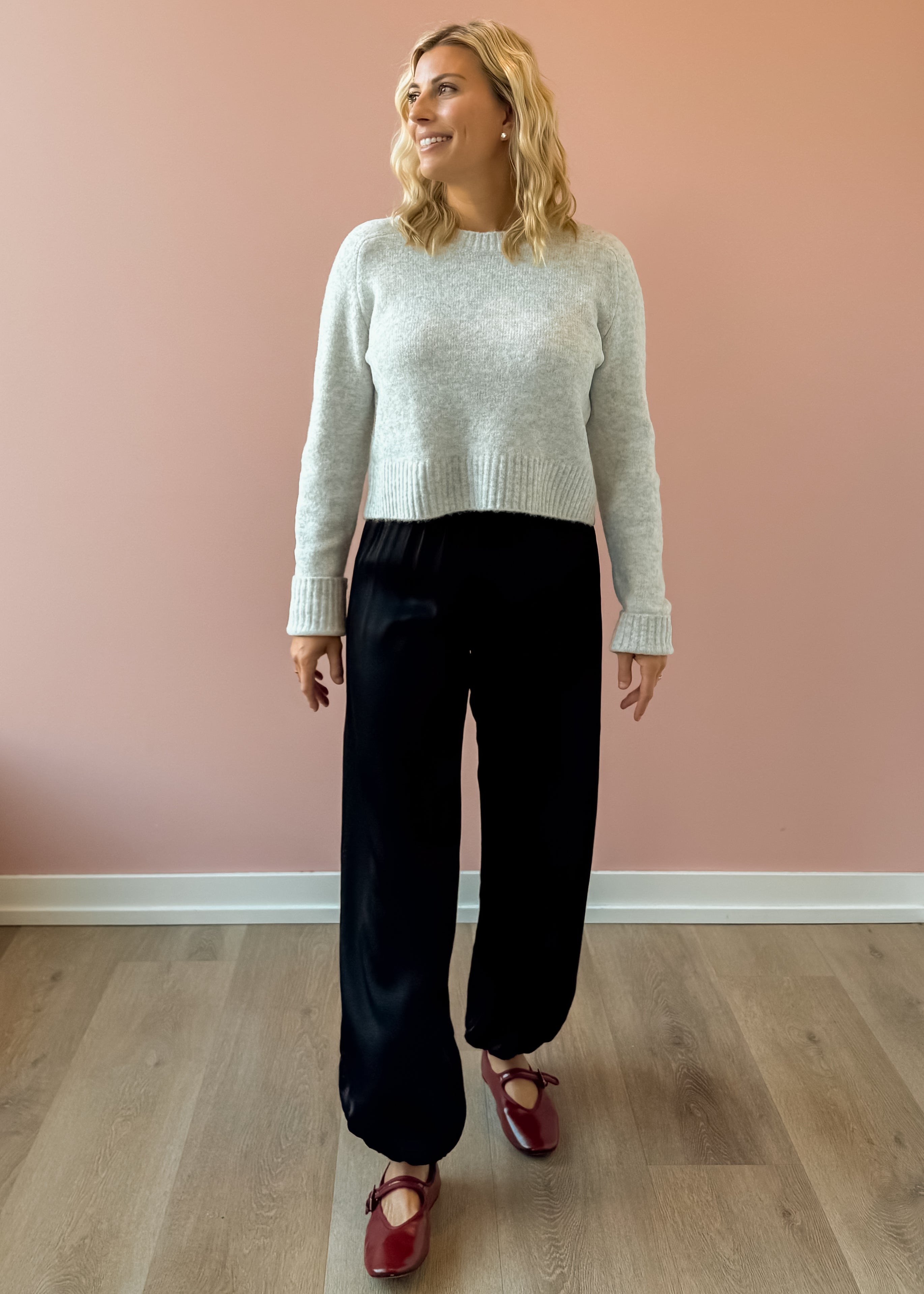 Olivaceous Jodi Satin Pants in black, front view.