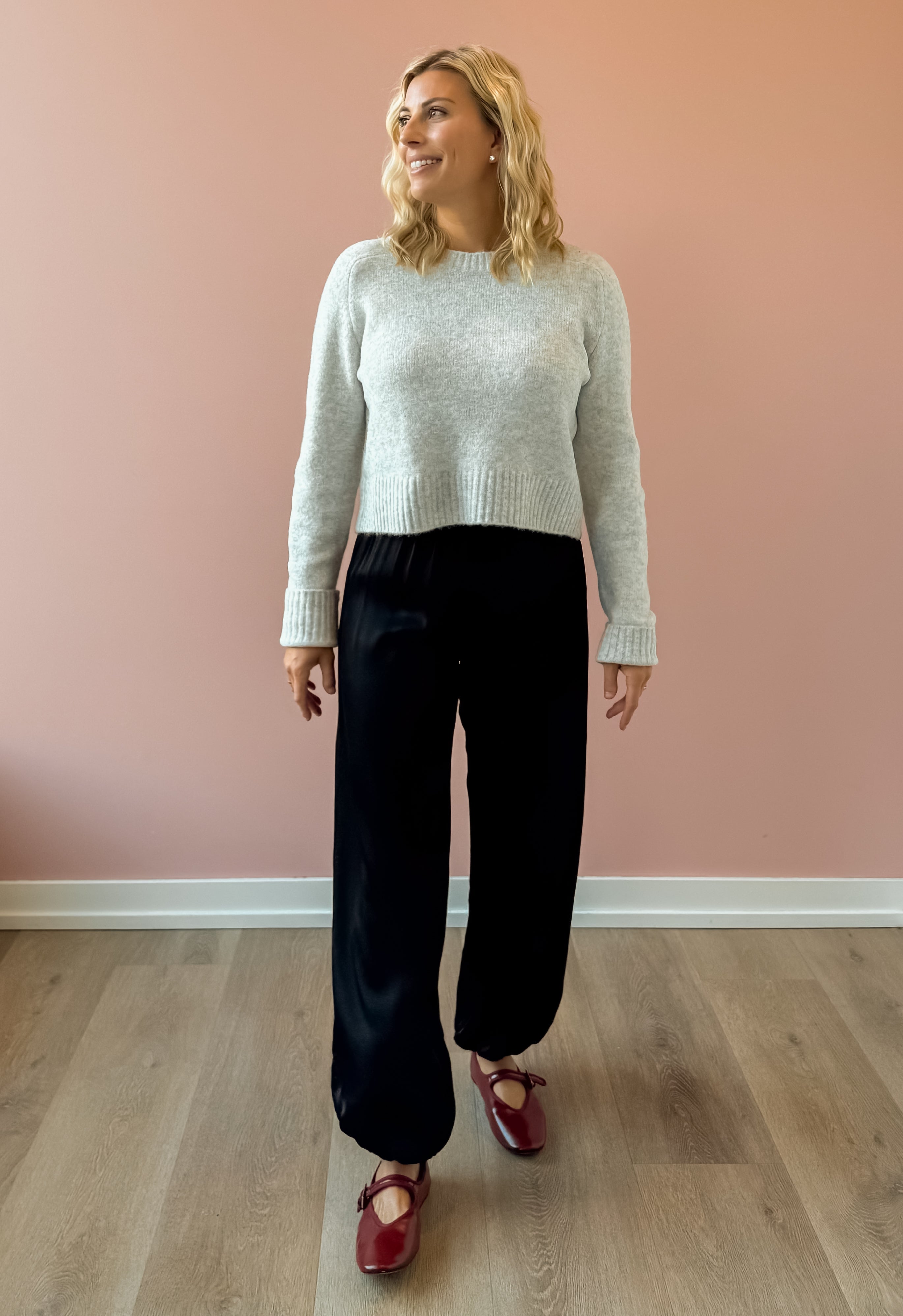 Olivaceous Jodi Satin Pants in black, front view.