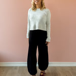 Olivaceous Jodi Satin Pants in black, front view.
