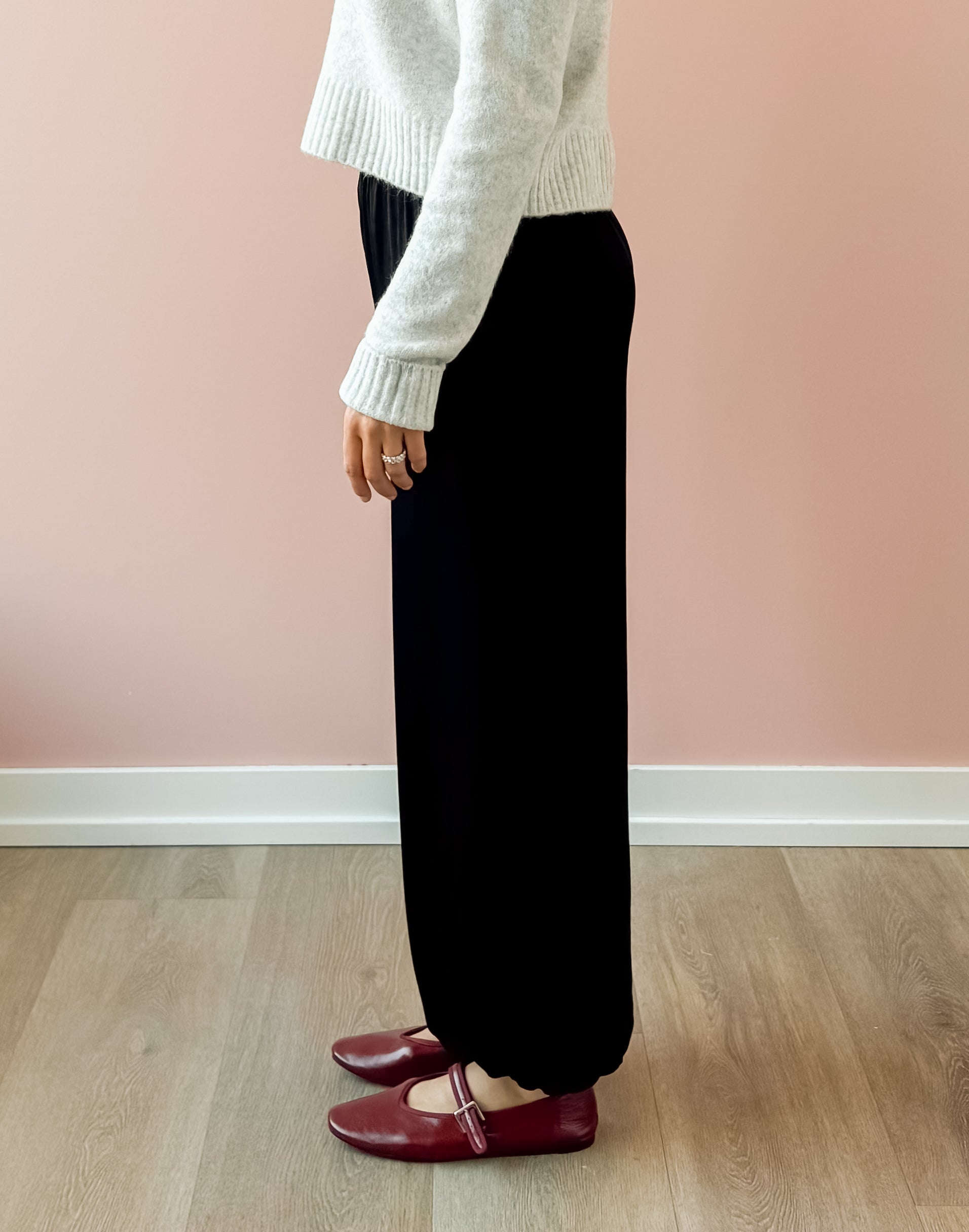 Olivaceous Jodi Satin Pants in black, side view.