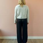 Olivaceous Jodi Satin Pants in black, back view.