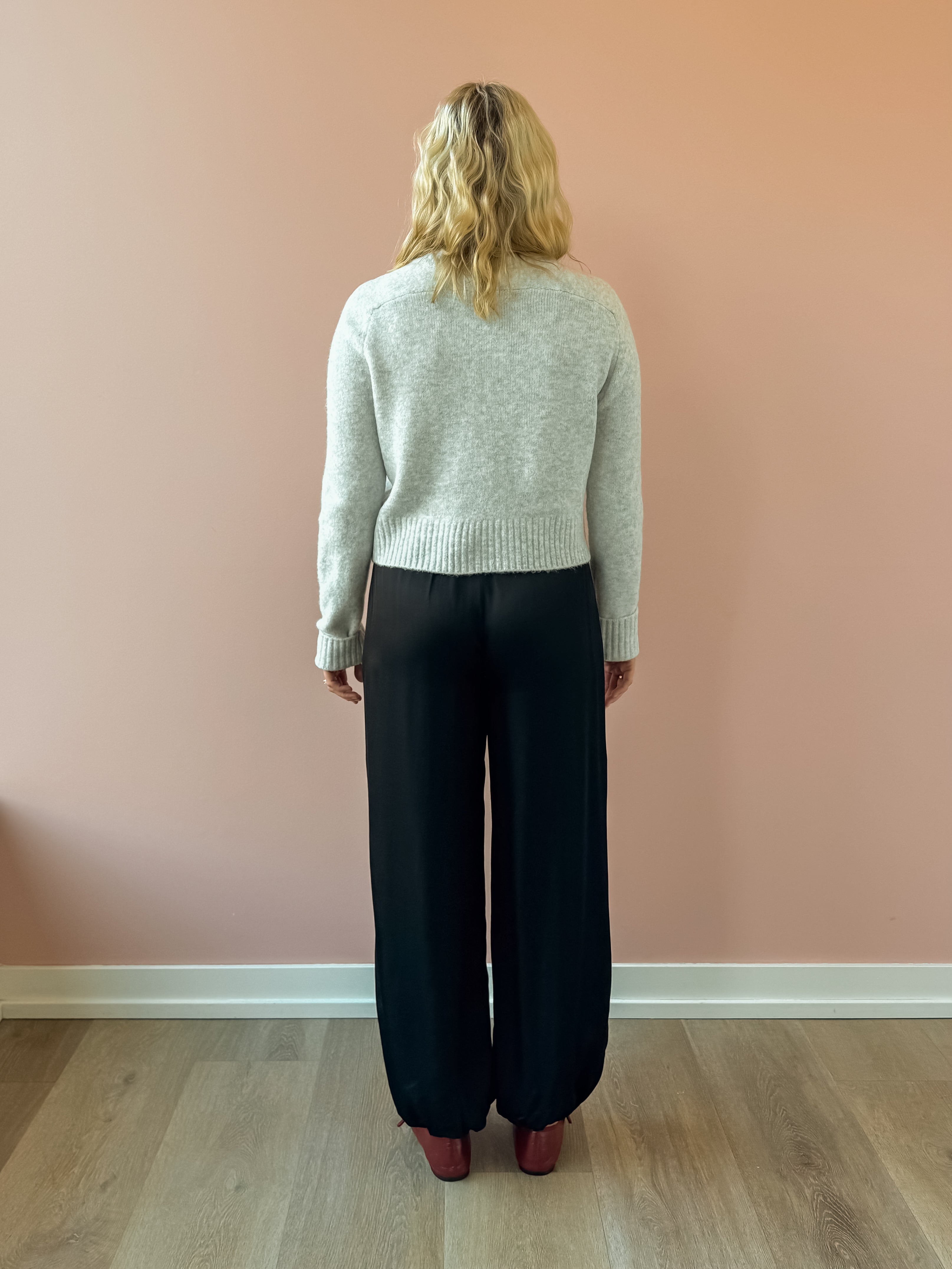 Olivaceous Jodi Satin Pants in black, back view.