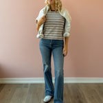 Olivaceous Mila Stripe Baby Tee in brown and white stripe, front view, sweatshirt over shoulders.