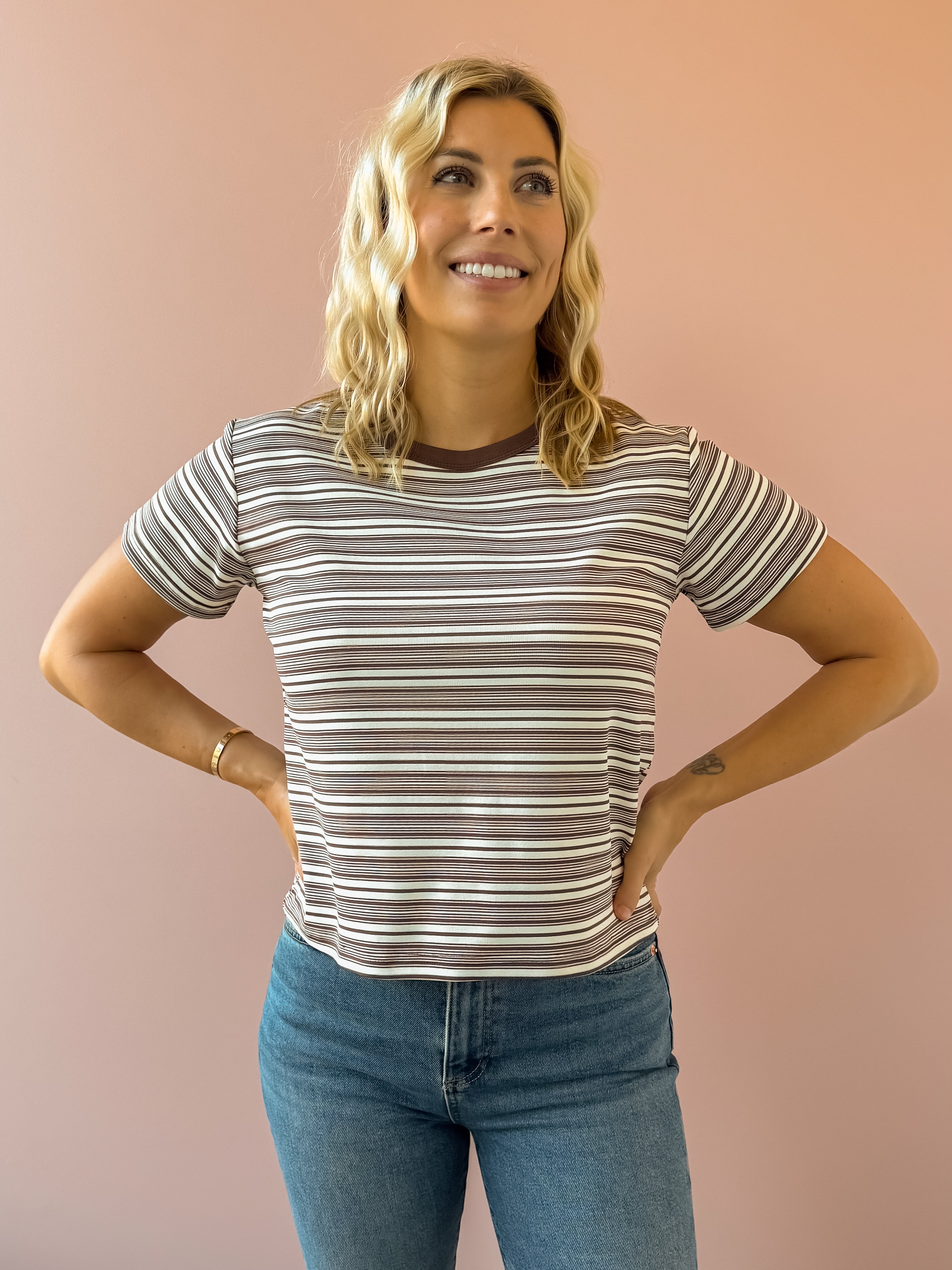 Olivaceous Mila Stripe Baby Tee in brown and white stripe, front view.