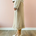 Zoe & Claire Naomi Dress Set in oatmeal, side view, lace hem detail.