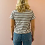 Olivaceous Mila Stripe Baby Tee in brown and white stripe, back view.