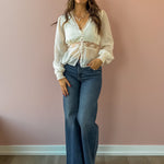 Sage The Label Monaco Peplum Top in cream, front view.