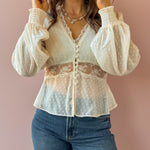 Sage The Label Monaco Peplum Top in cream, close-up of lace waist detail.