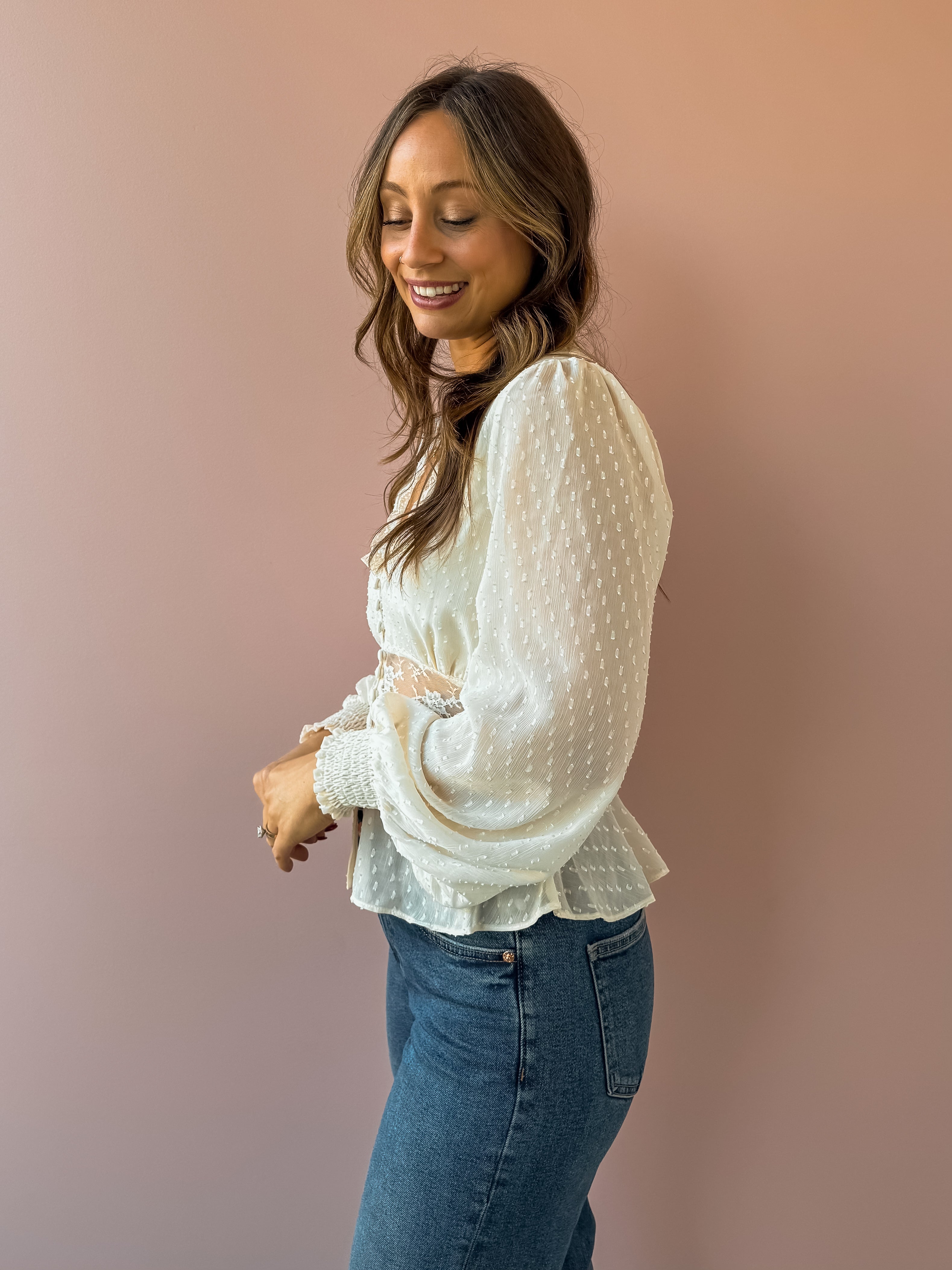 Sage The Label Monaco Peplum Top in cream, side close-up.