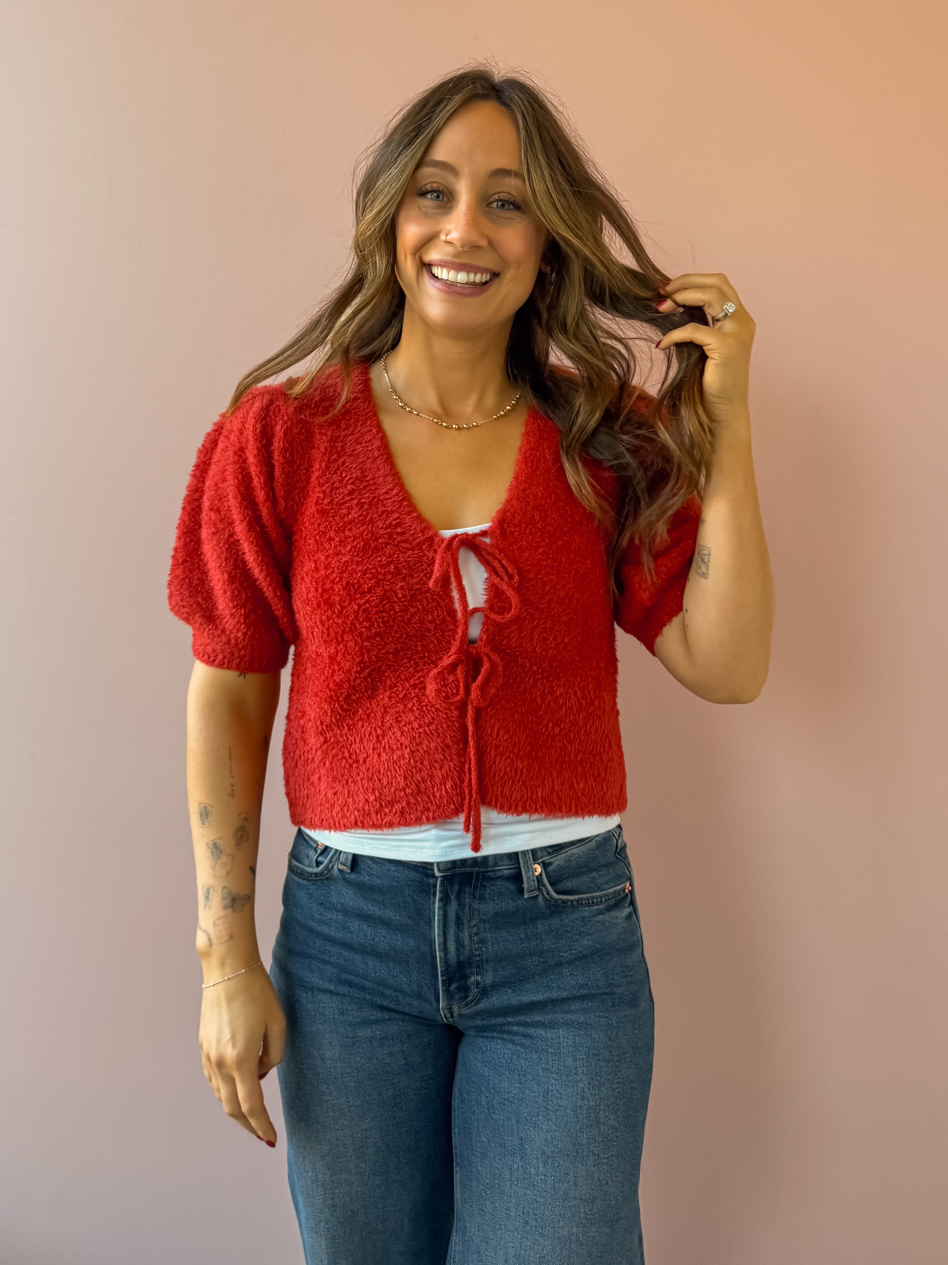 Saltwater Luxe Aeris Front Tie Sweater in red, front close-up.