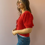 Saltwater Luxe Aeris Front Tie Sweater in red, side close-up.