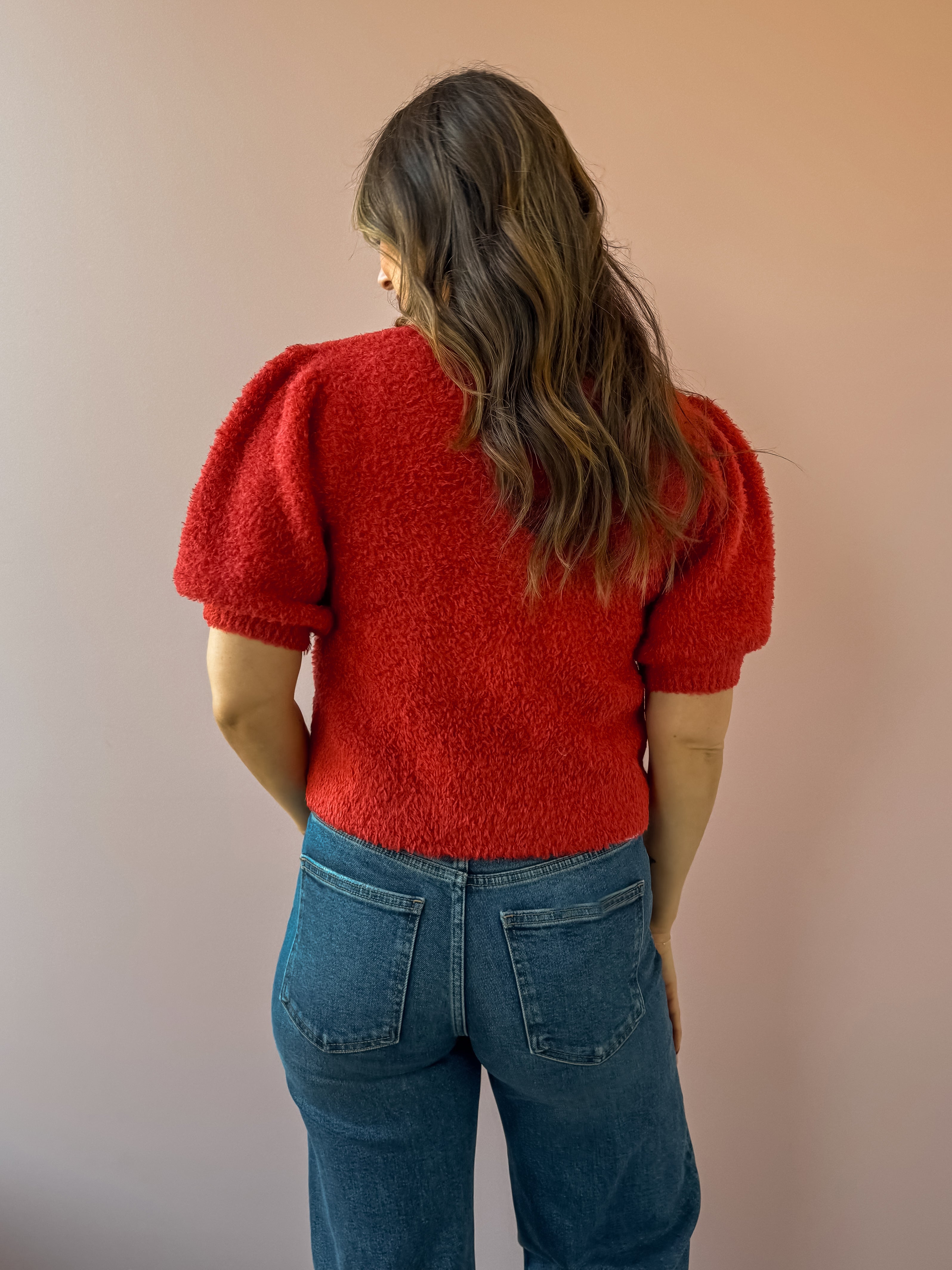 Saltwater Luxe Aeris Front Tie Sweater in red, back close-up.