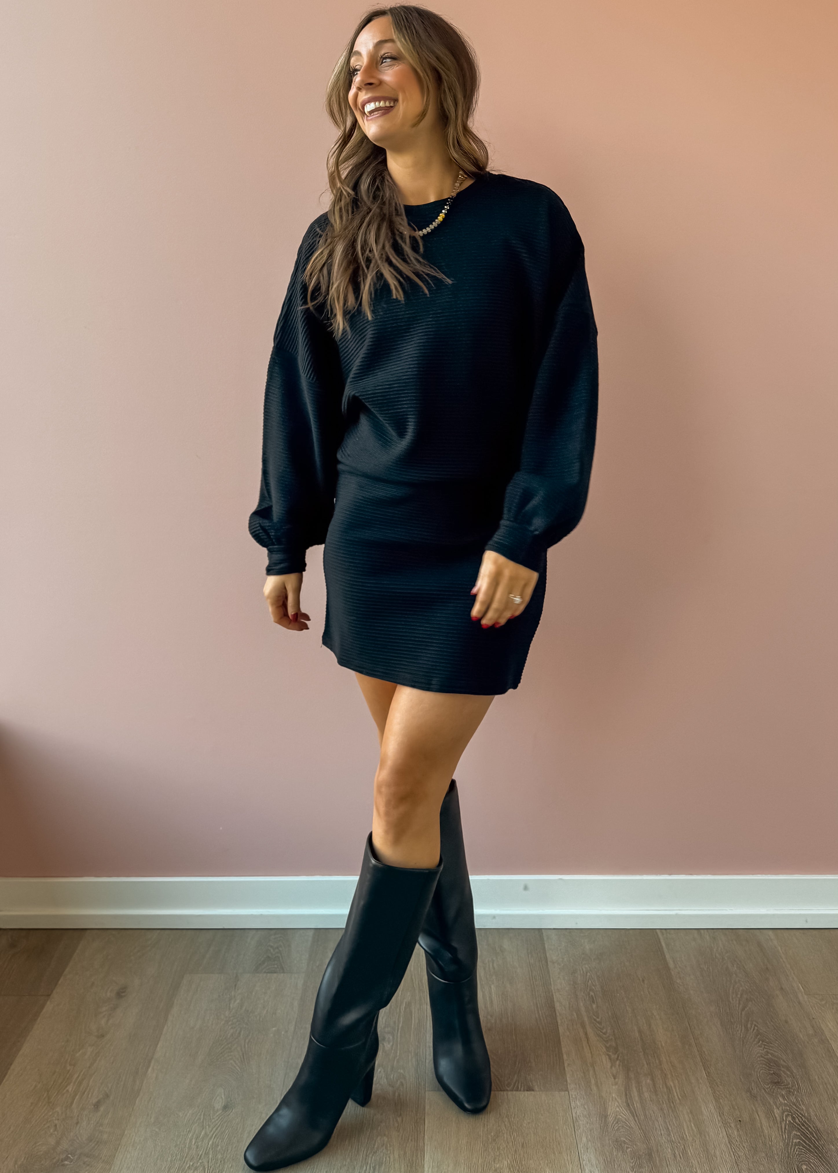 Sadie & Sage On A Stroll Mini Skirt in black, three-quarter view.