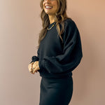 Sadie & Sage On A Stroll Dolman Sleeve Top in black, three-quarter close-up.