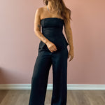 Sadie & Sage Gilded Evening Pinstripe Pants in black with silver pinstripes, full-length front view.