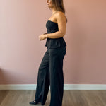 Sadie & Sage Gilded Evening Pinstripe Pants in black with silver pinstripes, side view.