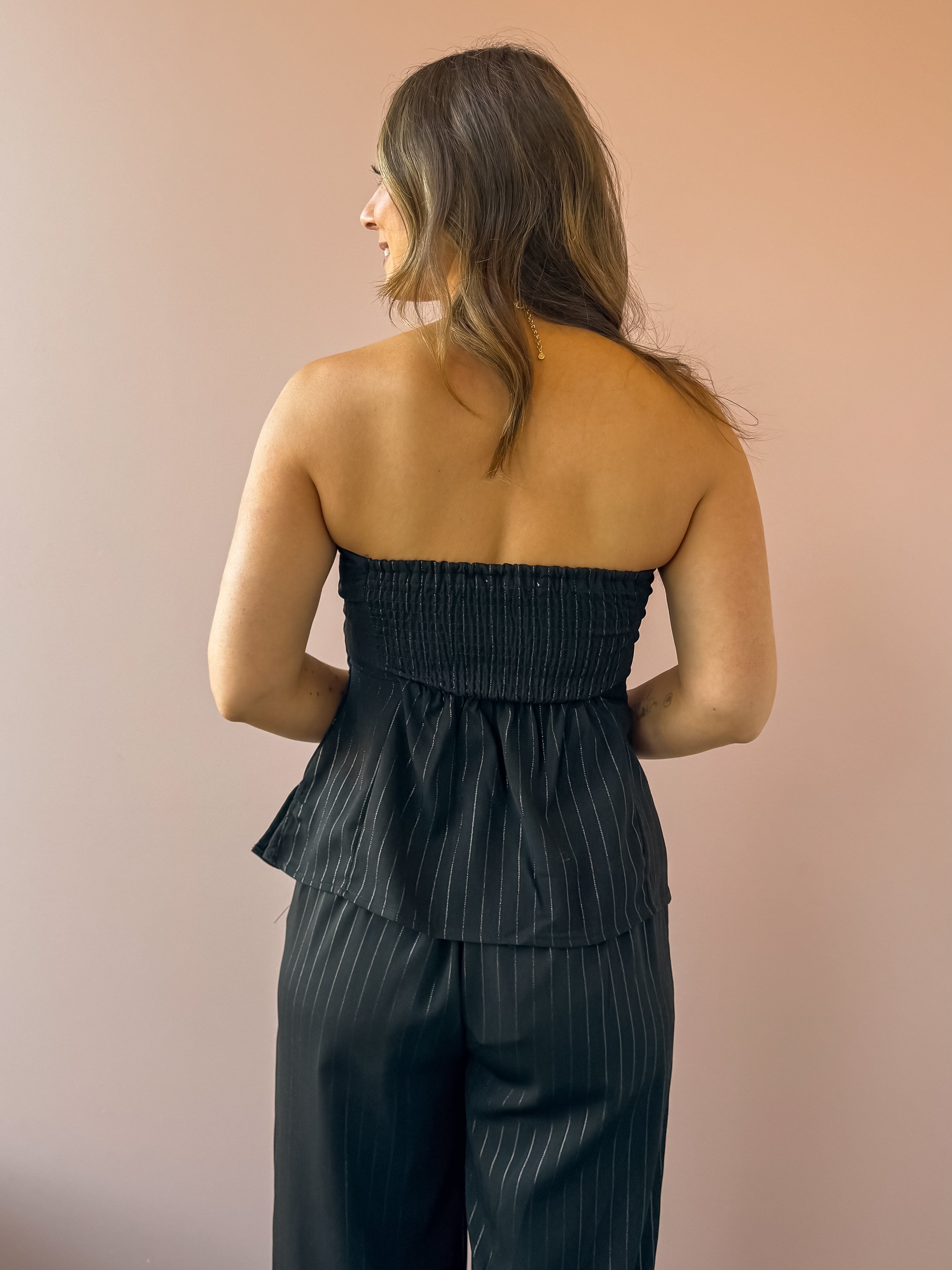 Sadie & Sage Gilded Evening Pinstripe Tube Top in black with silver pinstripes, back close-up.