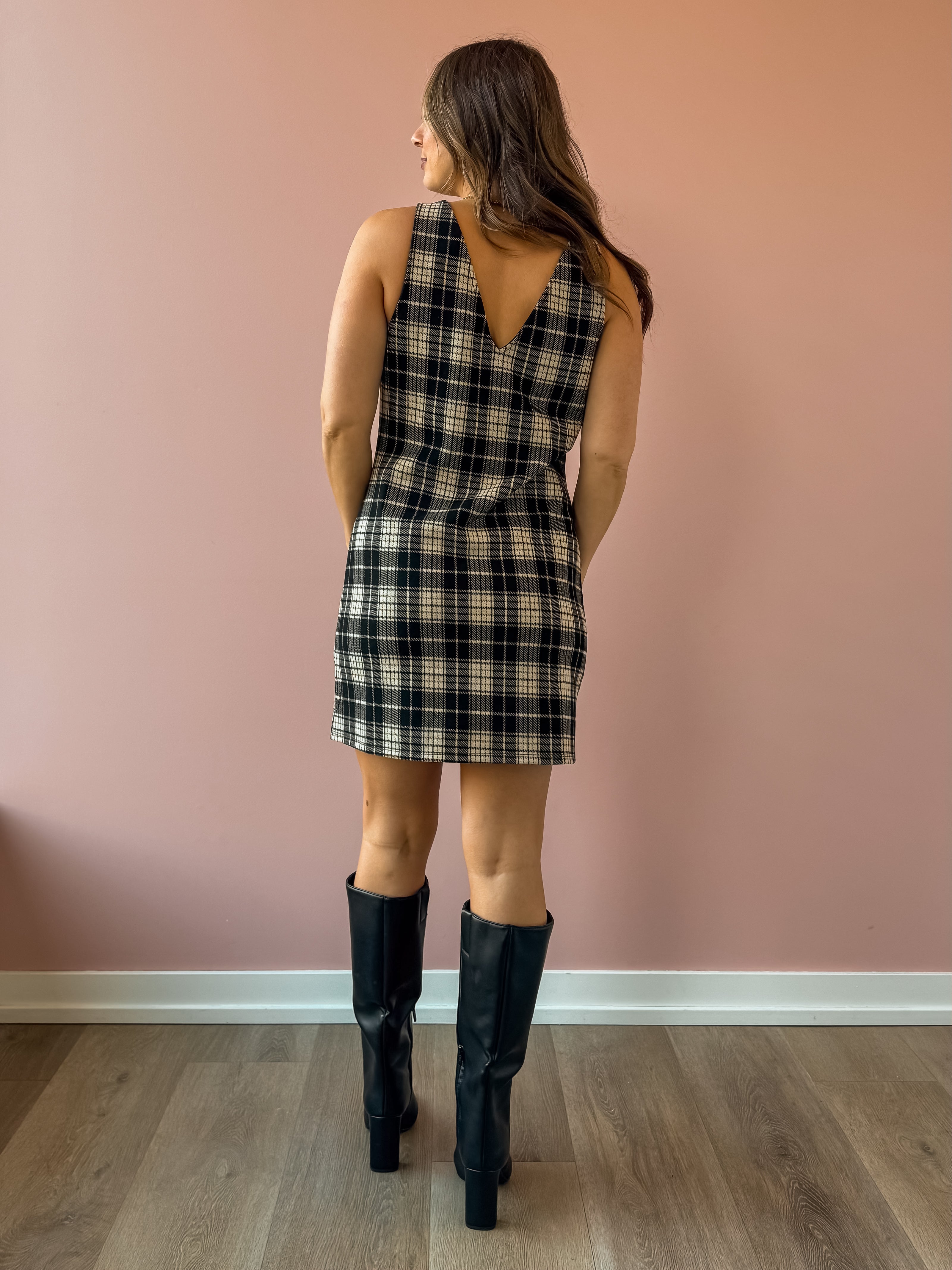 Sadie & Sage Served Up Stretch Plaid Mini Dress in black and tan plaid, back view.