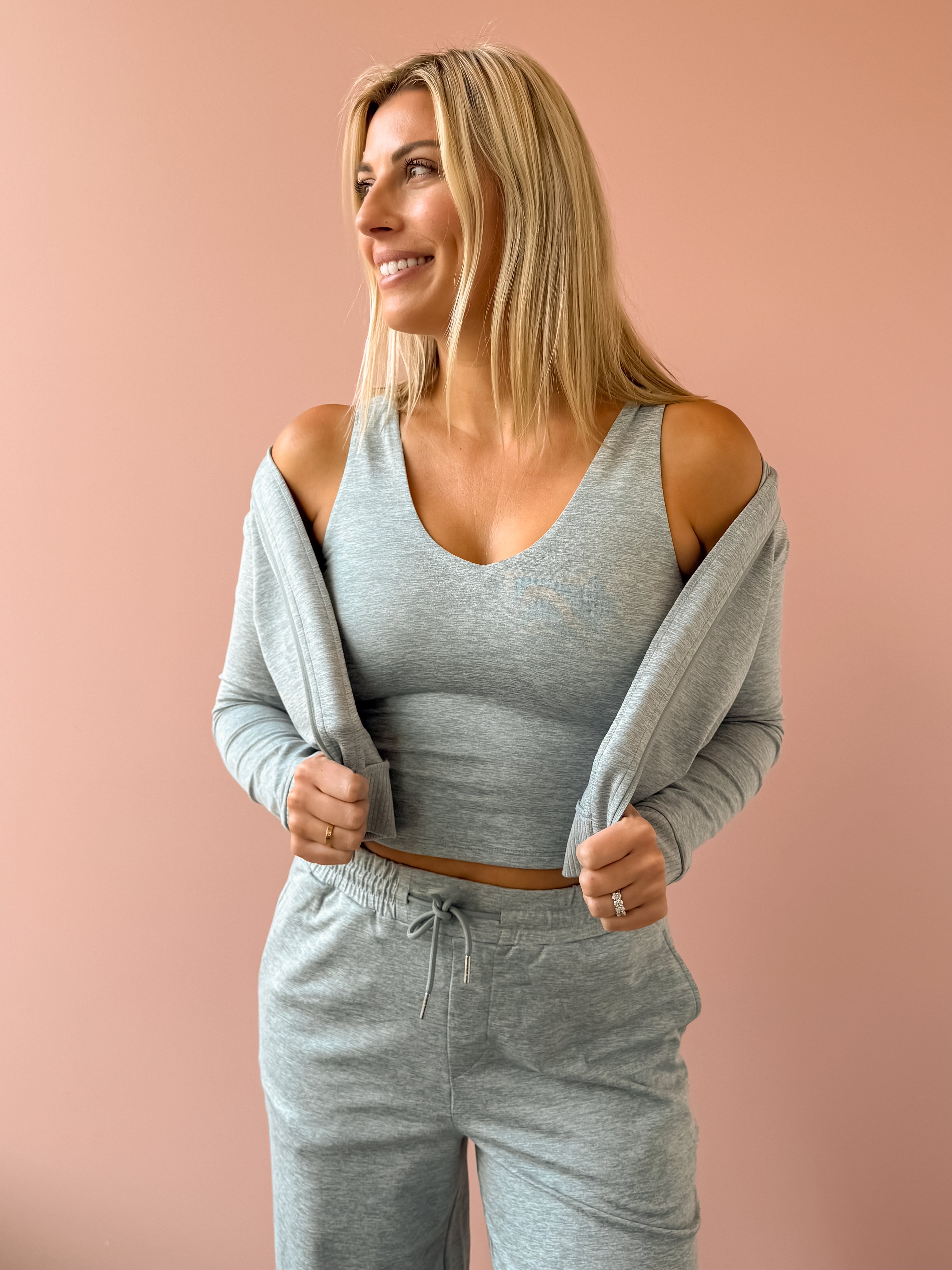 Varley Ruby Cropped Tank, Rufus Cropped Zip Through and Motion Easy Jogger 30 in grey, front close-up.
