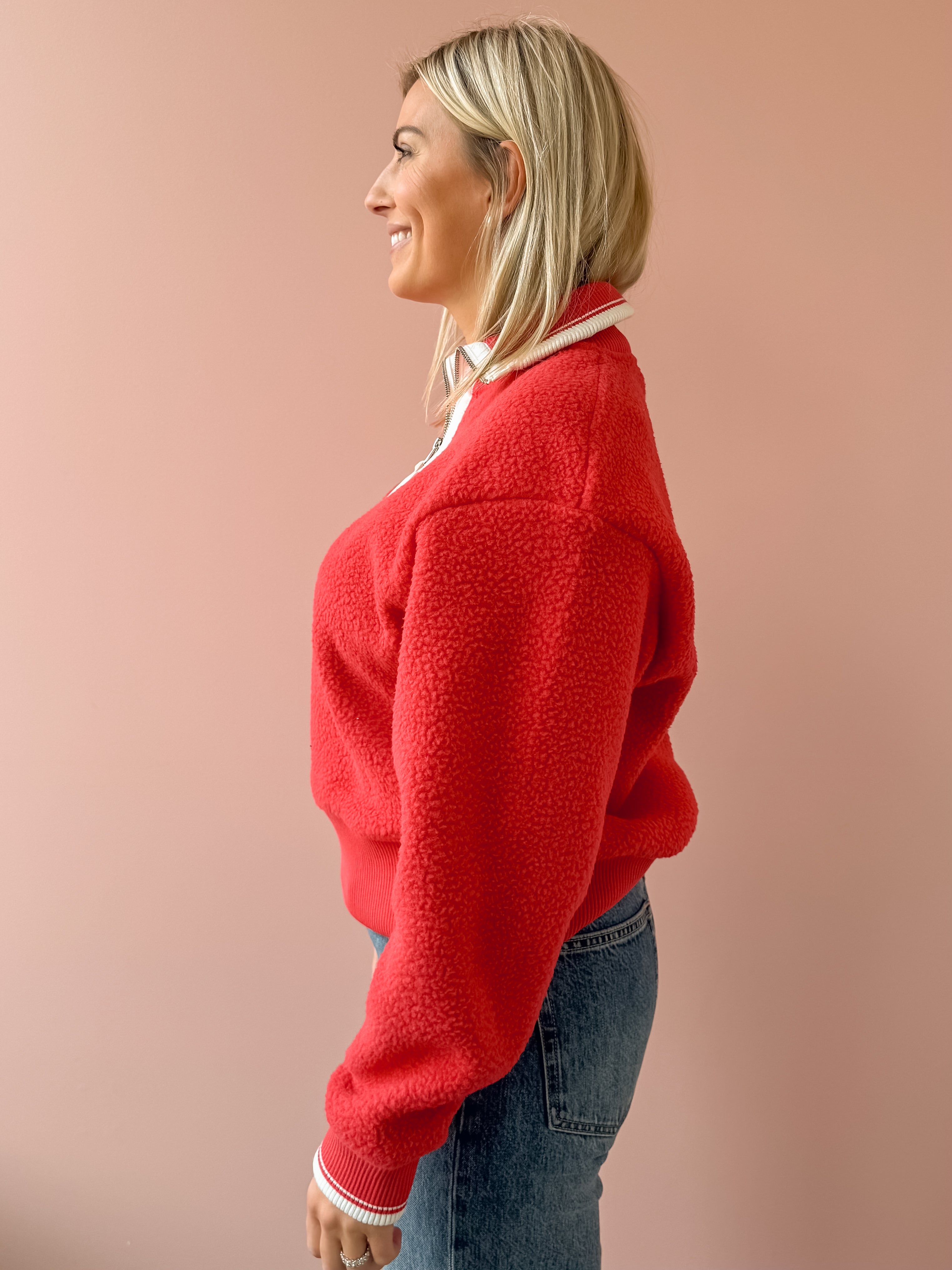 Varley Anika Half Zip Fleece in red, side close-up.