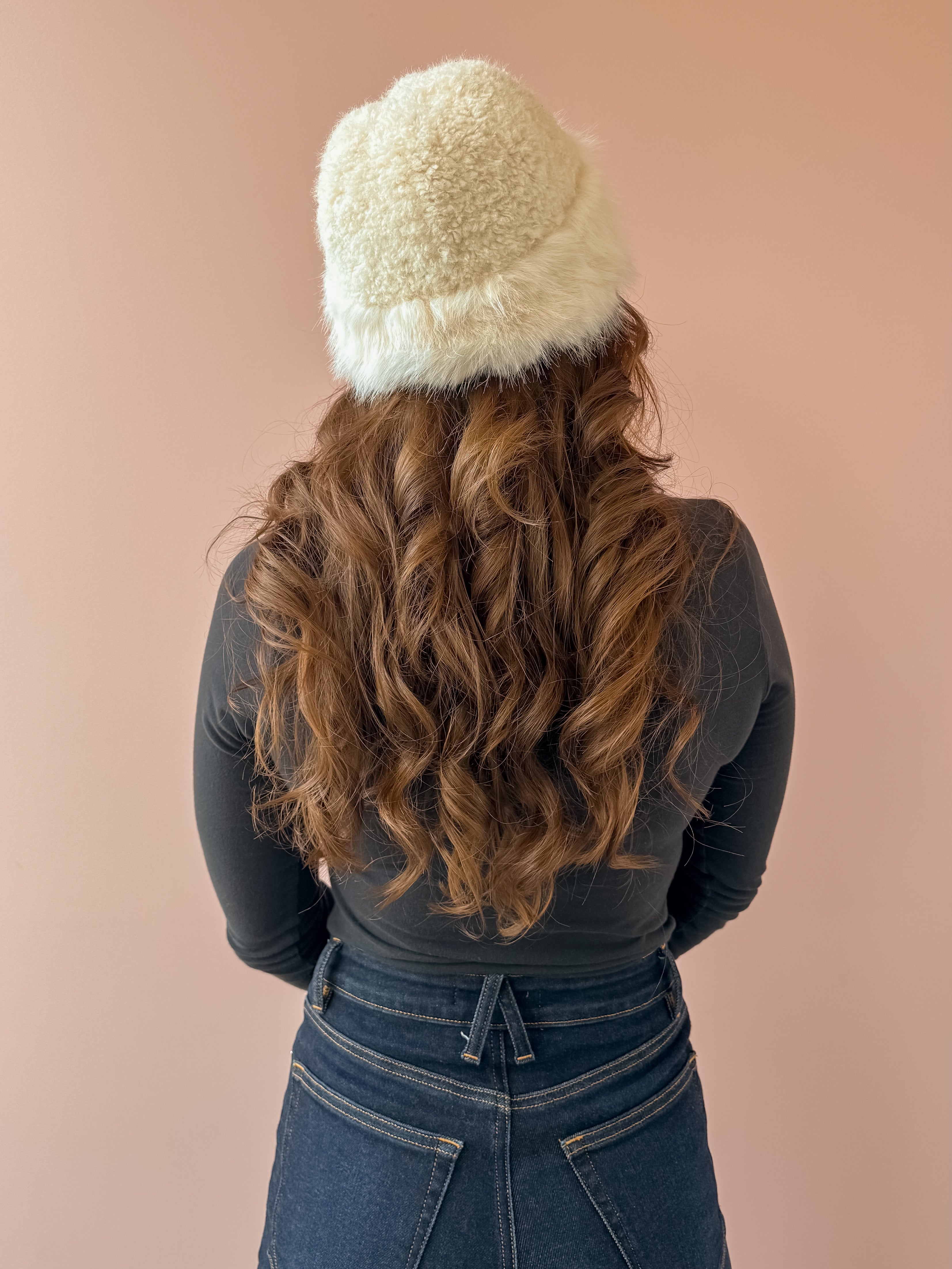 Common Knit Franny Dome Faux Fur Hat in cream, back view.
