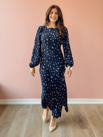 Z Supply Midnight Tansy navy floral midi dress with billowy long sleeves and nude heels, full length